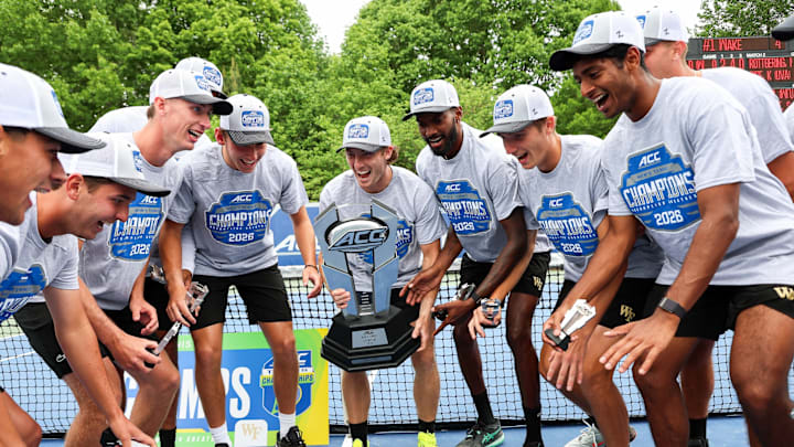 The Wake Forest Demon Deacons men's tennis team celebrate after winning the ACC Tournament title