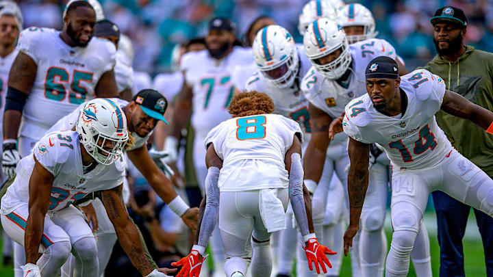 Miami Dolphins enter the field before the start of their game against the Cleveland Browns during