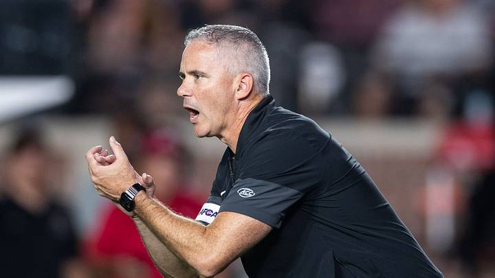 Florida State football coach Mike Norvell coaches his players as they warm up after the game was delayed due to a power outage. The SMU Mustangs beat the Florida State Seminoles 27-24 on Monday, Sept. 7, 2026. Florida State football coach Mike Norvell coaches his players as they warm up after the game was delayed due to a power outage. The SMU Mustangs beat the Florida State Seminoles 27-24 on Monday, Sept. 7, 2026.
