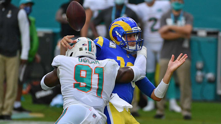 Miami Dolphins defensive end Emmanuel Ogbah (91) forces the fumble of Los Angeles Rams quarterback Jared Goff (16) during the first half at Hard Rock Stadium in the 2020 matchup.