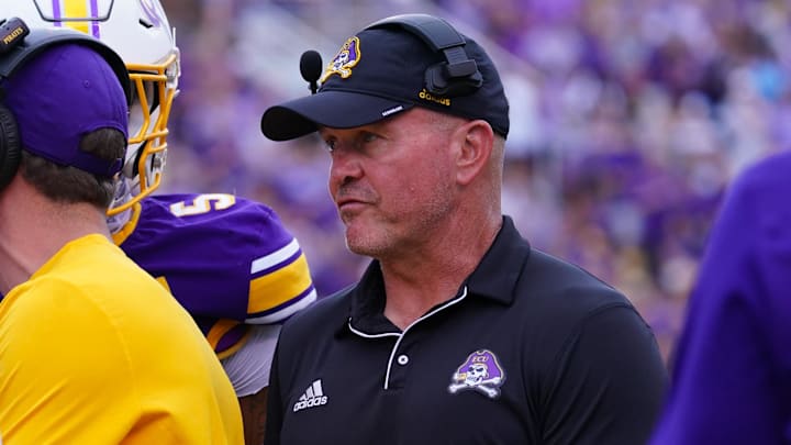 Sep 14, 2024; Greenville, North Carolina, USA; East Carolina Pirates head coach Mike Houston looks on against the Appalachian State Mountaineers during the first half at Dowdy-Ficklen Stadium. Sep 14, 2024; Greenville, North Carolina, USA; East Carolina Pirates head coach Mike Houston looks on against the Appalachian State Mountaineers during the first half at Dowdy-Ficklen Stadium.