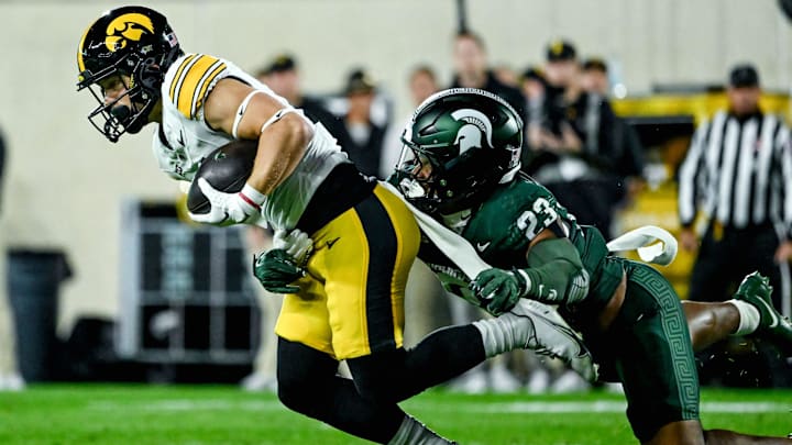 Michigan State's Darius Snow, right, tackles Iowa's Kaden Wetjen in the first quarter on Saturday, Oct. 19, 2024, at Spartan Stadium in East Lansing.