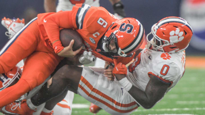 Sep 30, 2023; Syracuse, New York, USA; Clemson linebacker Barrett Carter (0) sacks Syracuse quarterback Garrett Shrader (6) during the third quarter at JMA Wireless Dome. 