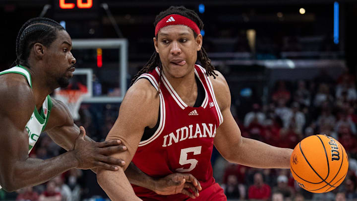 Indiana Hoosiers forward Malik Reneau (5) drives Thursday, March 13, 2025, against Oregon Ducks forward Supreme Cook (7) during the 2025 TIAA Big Ten Men’s Basketball Tournament at Gainbridge Fieldhouse in Indianapolis.