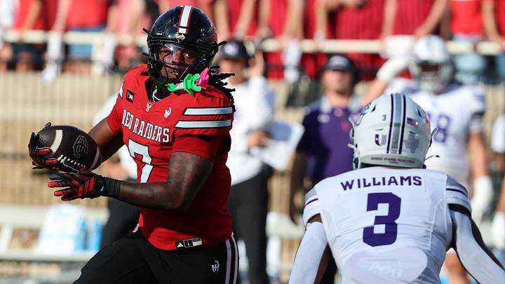 Sep 5, 2026; Lubbock, Texas, USA; Texas Tech Red Raiders tight end Terrance Carter Jr. (7) rushes with the ball against Abilene Christian Wildcats defensive Dillion Williams (3) in the first half at Galaxy Stadium. Mandatory Credit: Michael C. Johnson-Imagn Images Sep 5, 2026; Lubbock, Texas, USA; Texas Tech Red Raiders tight end Terrance Carter Jr. (7) rushes with the ball against Abilene Christian Wildcats defensive Dillion Williams (3) in the first half at Galaxy Stadium. Mandatory Credit: Michael C. Johnson-Imagn Images
