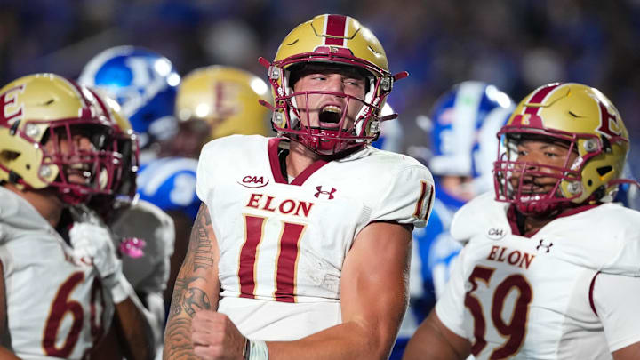 Aug 28, 2025; Durham, North Carolina, USA;  Elon Phoenix quarterback Landen Clark (11) celebrates his touchdown run against the Duke Blue Devils during the first half at Wallace Wade Stadium. Mandatory Credit: James Guillory-Imagn Images
