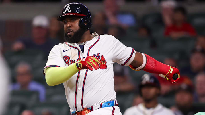 Jun 17, 2025; Atlanta, Georgia, USA; Atlanta Braves designated hitter Marcell Ozuna (20) hits an RBI double against the New York Mets in the eighth inning at Truist Park. Mandatory Credit: Brett Davis-Imagn Images
