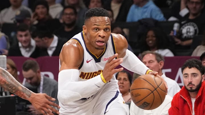 Denver Nuggets point guard Russell Westbrook (4) dribbles toward the basket against the Brooklyn Nets during the first half of the game at Barclays Center. 