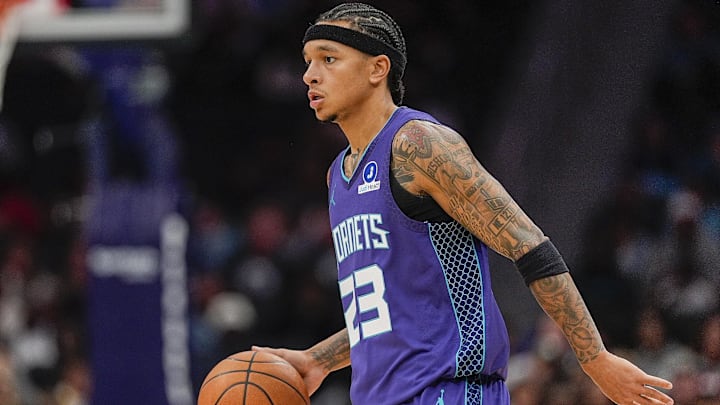 Nov 2, 2025; Charlotte, North Carolina, USA; Charlotte Hornets guard Tre Mann (23) handles the ball against the Utah Jazz during the first quarter at Spectrum Center. Mandatory Credit: Jim Dedmon-Imagn Images