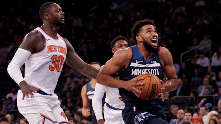 Oct 14, 2023; New York, New York, USA; Minnesota Timberwolves center Karl-Anthony Towns (32) drives to the basket against New York Knicks forward Julius Randle (30) and guard RJ Barrett (9) during the first quarter at Madison Square Garden. Mandatory Credit: Brad Penner-Imagn Images Oct 14, 2023; New York, New York, USA; Minnesota Timberwolves center Karl-Anthony Towns (32) drives to the basket against New York Knicks forward Julius Randle (30) and guard RJ Barrett (9) during the first quarter at Madison Square Garden. Mandatory Credit: Brad Penner-Imagn Images