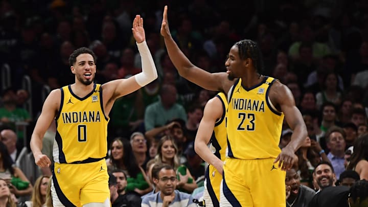 May 21, 2024; Boston, Massachusetts, USA; Indiana Pacers guard Tyrese Haliburton (0) reacts with forward Aaron Nesmith (23) during the second half for game one of the eastern conference finals for the 2024 NBA playoffs at TD Garden. Mandatory Credit: Bob DeChiara-Imagn Images
