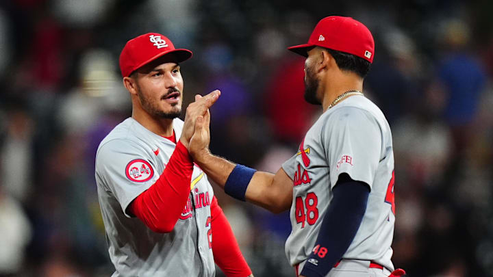 Sep 25, 2024; Denver, Colorado, USA; St. Louis Cardinals third base Nolan Arenado (28) and catcher Ivan Herrera (48) celebrate defeating the Colorado Rockies at Coors Field. Mandatory Credit: Ron Chenoy-Imagn Images