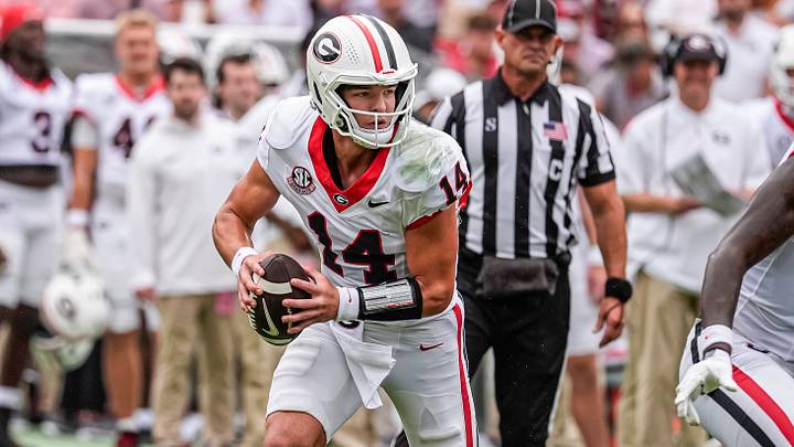 Sep 12, 2026; Athens, Georgia, USA; Georgia Bulldogs quarterback Gunner Stockton (14) rolls out and runs against the Western Kentucky Hilltoppers during the first half at Sanford Stadium. Mandatory Credit: Dale Zanine-Imagn Images