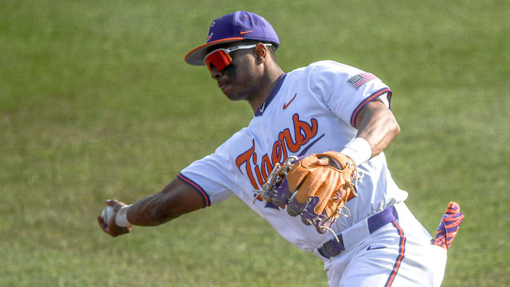 Clemson sophomore Jarren Purify (23) throws out a runner during the top of the first inning at Doug Kingsmore Stadium in Clemson, S.C. Wednesday, February 25, 2025.