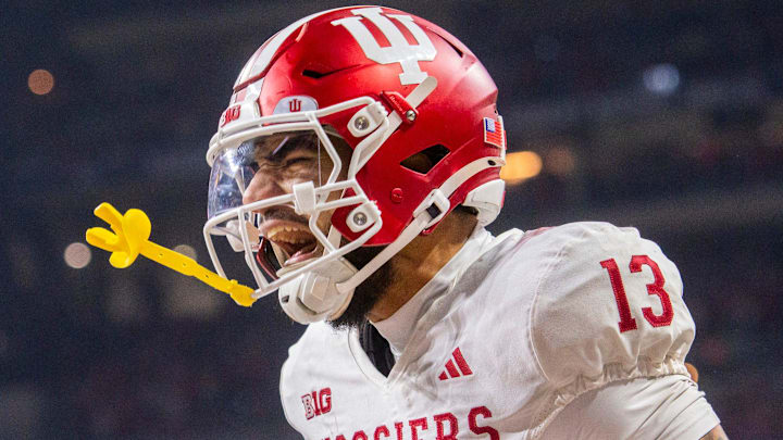 Indiana's Elijah Sarratt (13) celebrates a touchdown catch during the Indiana versus Ohio State Big Ten Championship football game at Lucas Oil Stadium on Saturday, Dec. 6, 2025. Indiana's Elijah Sarratt (13) celebrates a touchdown catch during the Indiana versus Ohio State Big Ten Championship football game at Lucas Oil Stadium on Saturday, Dec. 6, 2025.