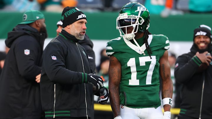 Jan 5, 2025; East Rutherford, New Jersey, USA; New York Jets interim head coach Jeff Ulbrich speaks with wide receiver Davante Adams (17) during pregame warmups for their game against the Miami Dolphins at MetLife Stadium. Mandatory Credit: Ed Mulholland-Imagn Images