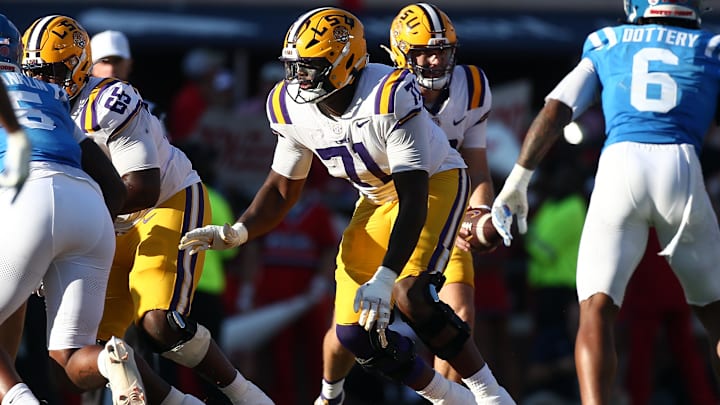 Sep 27, 2025; Oxford, Mississippi, USA; LSU Tigers offensive lineman Tyree Adams (71) blocks during the third quarter against the Mississippi Rebels at Vaught-Hemingway Stadium. Mandatory Credit: Petre Thomas-Imagn Images