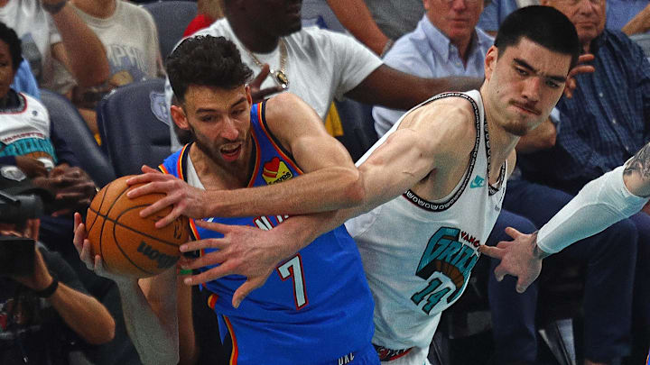 Apr 24, 2025; Memphis, Tennessee, USA; Oklahoma City Thunder forward Chet Holmgren (7) and Memphis Grizzlies center Zach Edey (14) battle for a rebound during the first quarter during game three for the first round of the 2024 NBA Playoffs at FedExForum. Mandatory Credit: Petre Thomas-Imagn Images