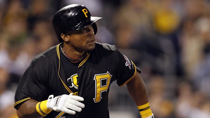 Sep 14, 2013; Pittsburgh, PA, USA; Pittsburgh Pirates right fielder Marlon Byrd (2) watches his solo home run clear the fence against the Chicago Cubs during the seventh inning at PNC Park. The Pittsburgh Pirates won 2-1. Mandatory Credit: Charles LeClaire-USA TODAY Sports