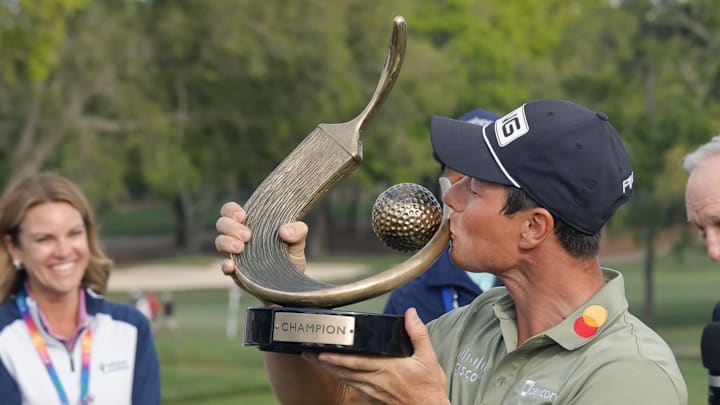 Mar 23, 2025; Palm Harbor, Florida, USA;  Viktor Hovland kisses the champions trophy after winning the Valspar Championship golf tournament at Innisbrook Resort. Mandatory Credit: Reinhold Matay-Imagn Images