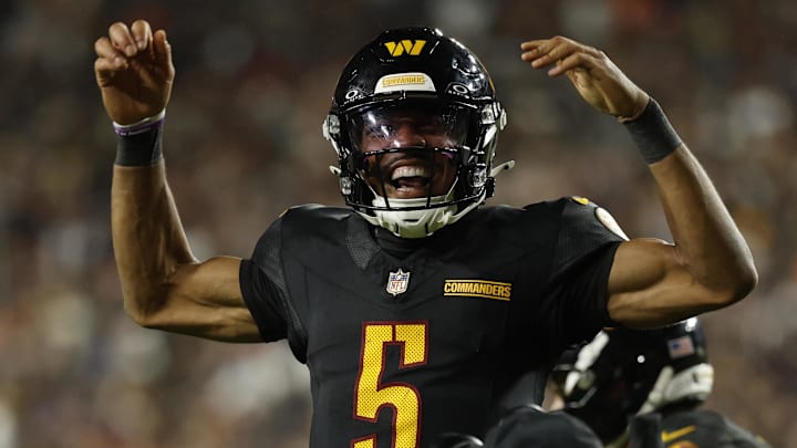 Oct 13, 2025; Landover, Maryland, USA; Washington Commanders quarterback Jayden Daniels (5) celebrates after throwing a touchdown pass against the Chicago Bears during the fourth quarter at Northwest Stadium. Mandatory Credit: Geoff Burke-Imagn Images Oct 13, 2025; Landover, Maryland, USA; Washington Commanders quarterback Jayden Daniels (5) celebrates after throwing a touchdown pass against the Chicago Bears during the fourth quarter at Northwest Stadium. Mandatory Credit: Geoff Burke-Imagn Images