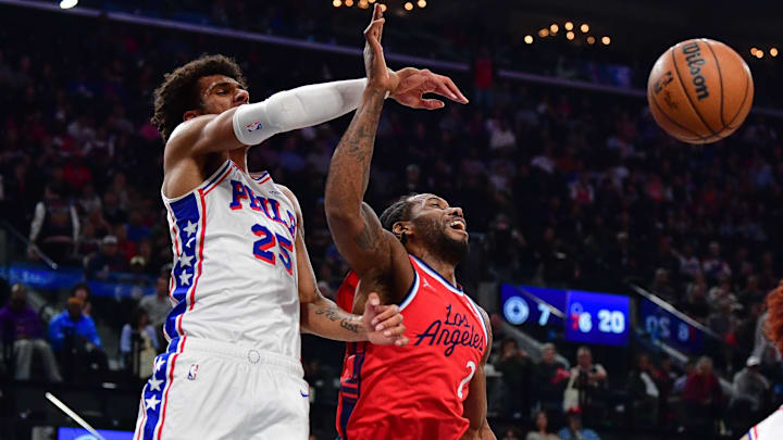 Feb 2, 2026; Inglewood, California, USA; Philadelphia 76ers forward Dominick Barlow (25) blocks the shot of Los Angeles Clippers forward Kawhi Leonard (2) during the first half at Intuit Dome. Mandatory Credit: Gary A. Vasquez-Imagn Images