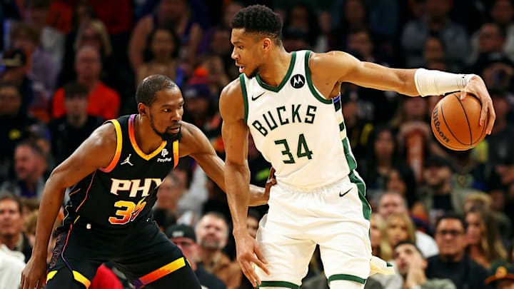 Feb 6, 2024; Phoenix, Arizona, USA; Milwaukee Bucks forward Giannis Antetokounmpo (34) handles the ball against the Phoenix Suns forward Kevin Durant (35) during the third quarter at Footprint Center. Mandatory Credit: Mark J. Rebilas-Imagn Images Feb 6, 2024; Phoenix, Arizona, USA; Milwaukee Bucks forward Giannis Antetokounmpo (34) handles the ball against the Phoenix Suns forward Kevin Durant (35) during the third quarter at Footprint Center. Mandatory Credit: Mark J. Rebilas-Imagn Images