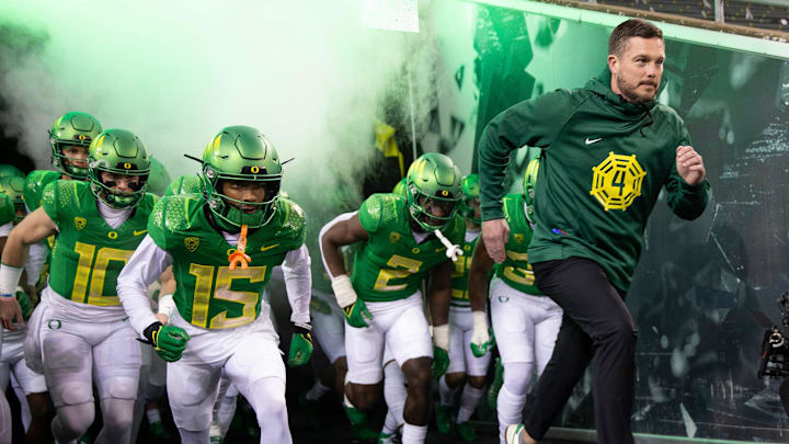 Oregon football coach Dan Lanning leads his team onto the field before the game against Oregon State at Autzen Stadium Friday, Nov. 24, 2023.