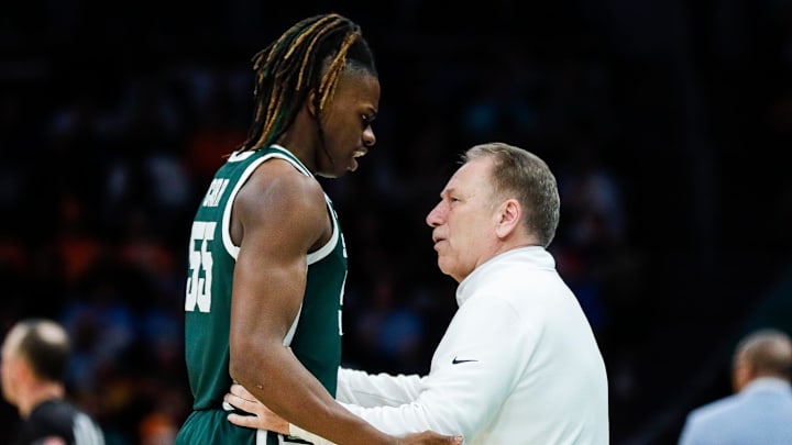 Michigan State head coach Tom Izzo talks to forward Coen Carr (55) during the second half of the NCAA tournament West Region second round against North Carolina at Spectrum Center in Charlotte, N.C. on Saturday, March 23, 2024.