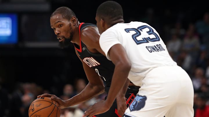 Nov 5, 2025; Memphis, Tennessee, USA; Houston Rockets forward Kevin Durant (7) dribbles as Memphis Grizzlies forward Cedric Coward (23) defends during the fourth quarter at FedExForum. Mandatory Credit: Petre Thomas-Imagn Images