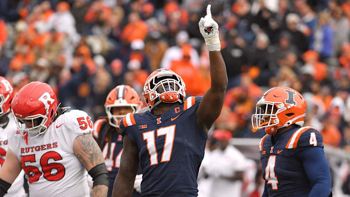 Nov 1, 2025; Champaign, Illinois, USA;  Illinois Fighting Illini linebacker Gabe Jacas (17) celebrates his sack on Rutgers Scarlet Knights quarterback Athan Kaliakmanis (16) during the first half at Memorial Stadium. 