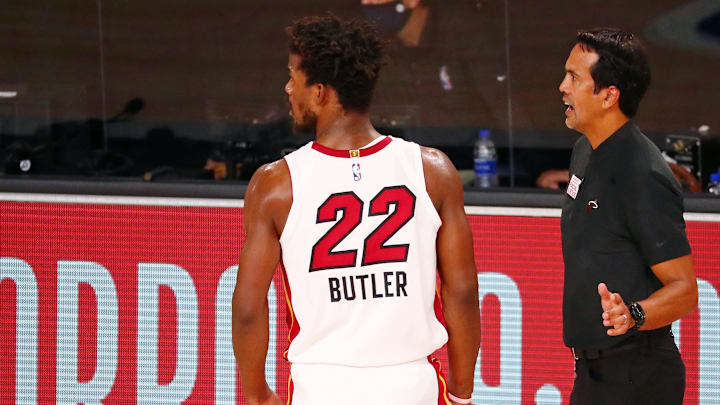 Sep 17, 2020; Lake Buena Vista, Florida, USA; Miami Heat forward Jimmy Butler (22) talks with head coach Erik Spoelstra during the fourth quarter in game two of the Eastern Conference Finals of the 2020 NBA Playoffs at ESPN Wide World of Sports Complex. The Miami Heat won 106-101. Mandatory Credit: Kim Klement-Imagn Images Sep 17, 2020; Lake Buena Vista, Florida, USA; Miami Heat forward Jimmy Butler (22) talks with head coach Erik Spoelstra during the fourth quarter in game two of the Eastern Conference Finals of the 2020 NBA Playoffs at ESPN Wide World of Sports Complex. The Miami Heat won 106-101. Mandatory Credit: Kim Klement-Imagn Images