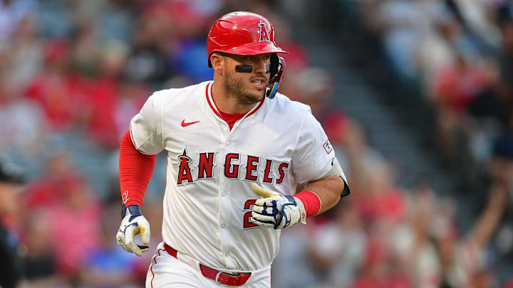 Aug 20, 2025; Anaheim, California, USA; Los Angeles Angels designated hitter Mike Trout (27) runs after hitting a single against the Cincinnati Reds during the first inning at Angel Stadium. Mandatory Credit: Gary A. Vasquez-Imagn Images