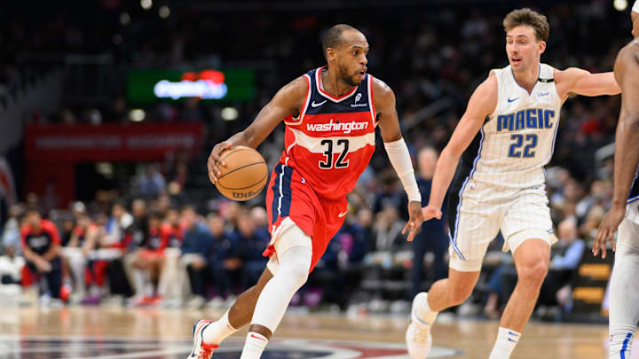 Mar 21, 2025; Washington, District of Columbia, USA; Washington Wizards forward Khris Middleton (32) handles the ball against Orlando Magic forward Franz Wagner (22) during the third quarter at Capital One Arena. Mandatory Credit: Reggie Hildred-Imagn Images