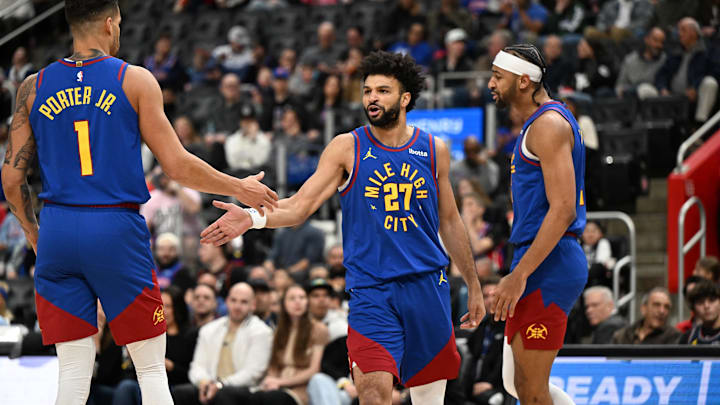 Feb 28, 2025; Detroit, Michigan, USA; Denver Nuggets guard Jamal Murray (27) celebrates with forwards Michael Porter Jr. (1) and Zeke Nnaji (22) after scoring and drawing a foul against the Detroit Pistons in the first quarter at Little Caesars Arena. Mandatory Credit: Lon Horwedel-Imagn Images Feb 28, 2025; Detroit, Michigan, USA; Denver Nuggets guard Jamal Murray (27) celebrates with forwards Michael Porter Jr. (1) and Zeke Nnaji (22) after scoring and drawing a foul against the Detroit Pistons in the first quarter at Little Caesars Arena. Mandatory Credit: Lon Horwedel-Imagn Images