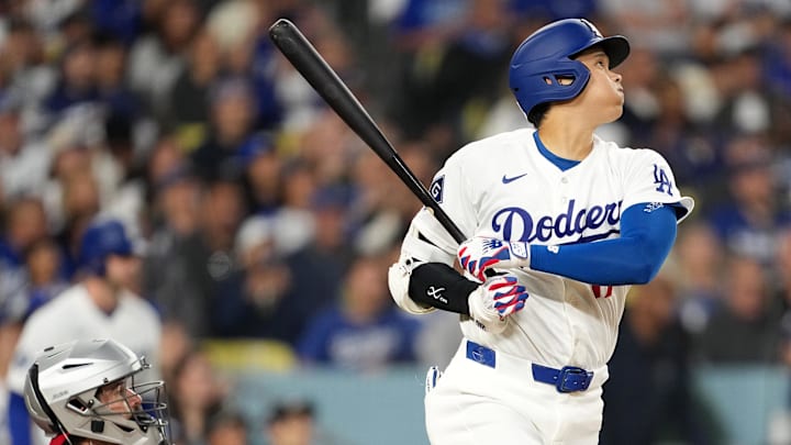 Mar 30, 2026; Los Angeles, California, USA; Los Angeles Dodgers two-way player Shohei Ohtani (17) hits a single against the Cleveland Guardians in the first inning at Dodger Stadium. Mandatory Credit: Kirby Lee-Imagn Images