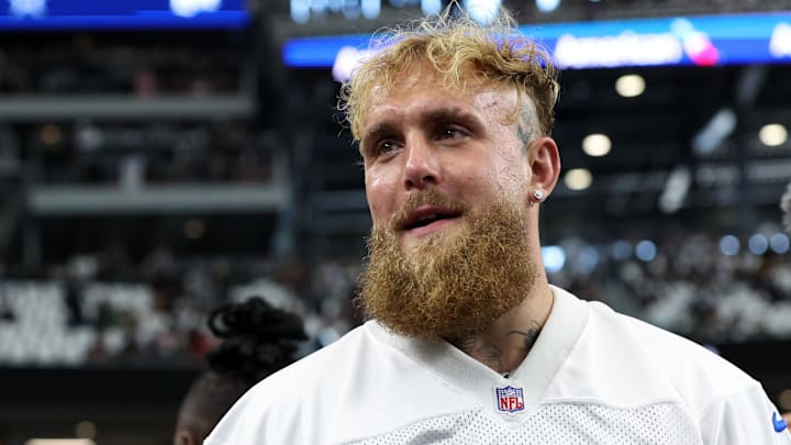 Boxer and influencer Jake Paul walks on the field before a game between the New Orleans Saints and Dallas Cowboys.