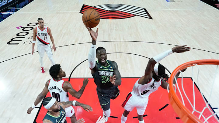Nov 13, 2024; Portland, Oregon, USA; Minnesota Timberwolves power forward Julius Randle (30) is fouled while shooting by Portland Trail Blazers small forward Jerami Grant (9) during the first half at Moda Center. Mandatory Credit: Soobum Im-Imagn Images