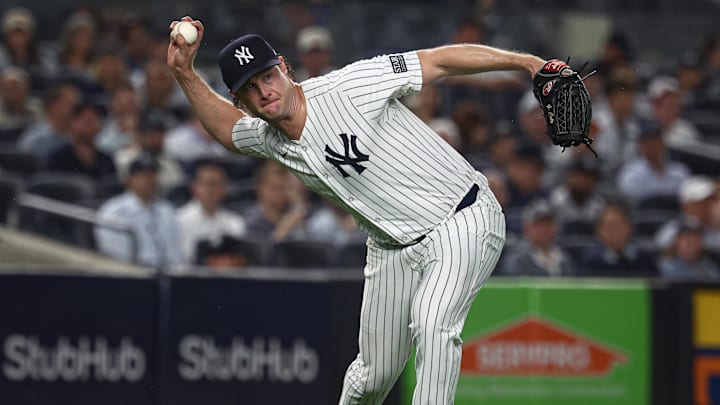 Sep 26, 2024; Bronx, New York, USA; New York Yankees starting pitcher Gerrit Cole (45) throws the ball to first base for an out during the fourth inning against the Baltimore Orioles at Yankee Stadium. Mandatory Credit: Vincent Carchietta-Imagn Images