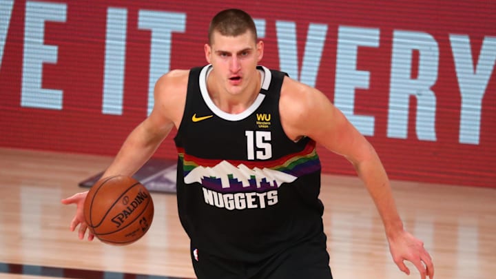 Sep 24, 2020; Lake Buena Vista, Florida, USA; Denver Nuggets center Nikola Jokic (15) dribbles the ball against the Los Angeles Lakers during the second half in game four of the Western Conference Finals of the 2020 NBA Playoffs at AdventHealth Arena. Mandatory Credit: Kim Klement-Imagn Images