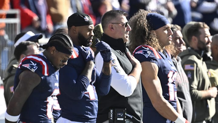 Nov 2, 2025; Foxborough, Massachusetts, USA;  New England Patriots head coach Mike Vrabel stands with his team for the National Anthem prior to the game against the Atlanta Falcons at Gillette Stadium. Mandatory Credit: Eric Canha-Imagn Images
