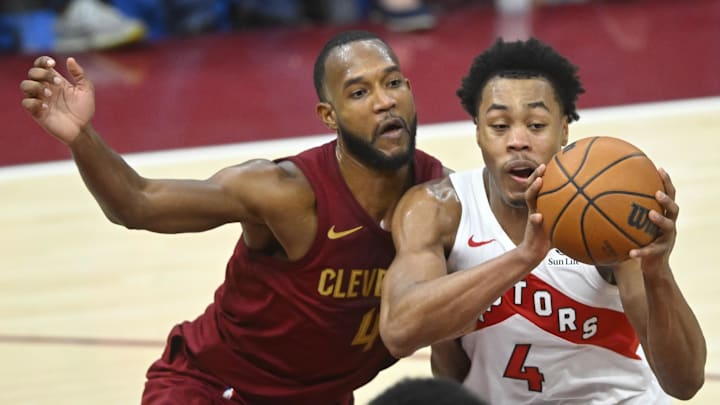 Jan 9, 2025; Cleveland, Ohio, USA; Cleveland Cavaliers forward Evan Mobley (4) defends Toronto Raptors forward Scottie Barnes (4) in the fourth quarter at Rocket Mortgage FieldHouse. Mandatory Credit: David Richard-Imagn Images Jan 9, 2025; Cleveland, Ohio, USA; Cleveland Cavaliers forward Evan Mobley (4) defends Toronto Raptors forward Scottie Barnes (4) in the fourth quarter at Rocket Mortgage FieldHouse. Mandatory Credit: David Richard-Imagn Images