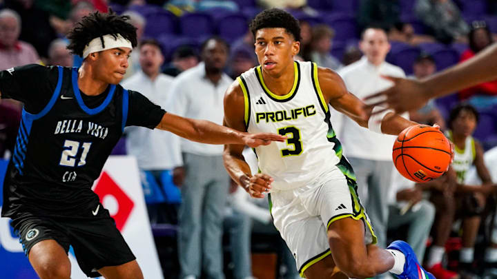 Prolific Prep Crew guard Bruce Branch II (3) drives to the basket as CIA-Bella Vista Bears guard Lyris Robinson (21) guards him during the first quarter of a City of Palms Classic Signature Series game at Suncoast Credit Union Arena in Fort Myers, Fla., on Friday, Dec. 19, 2025.