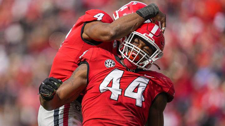 Nov 6, 2021; Athens, Georgia, USA; Georgia Bulldogs defensive lineman Travon Walker (44) reacts with linebacker Nolan Smith (4) after a sack against the Missouri Tigers during the second half at Sanford Stadium. Mandatory Credit: Dale Zanine-Imagn Images Nov 6, 2021; Athens, Georgia, USA; Georgia Bulldogs defensive lineman Travon Walker (44) reacts with linebacker Nolan Smith (4) after a sack against the Missouri Tigers during the second half at Sanford Stadium. Mandatory Credit: Dale Zanine-Imagn Images