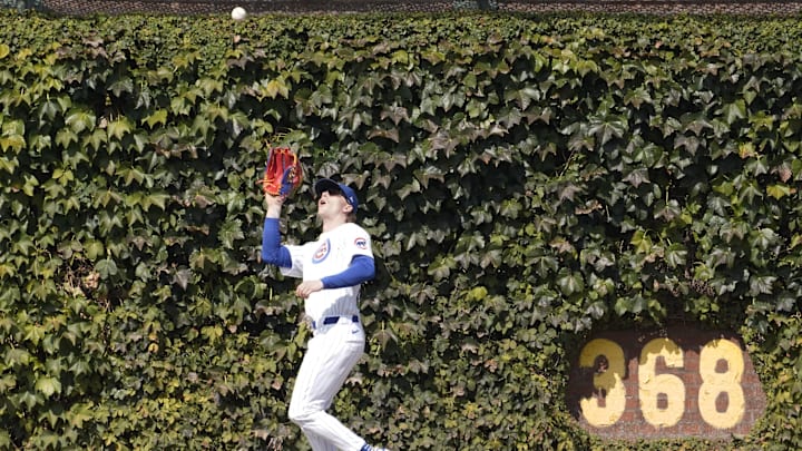 Sep 20, 2024; Chicago, Illinois, USA; Chicago Cubs outfielder Pete Crow-Armstrong (52) makes a catch on Washington Nationals catcher Drew Millas (not pictured) during the fourth inning at Wrigley Field. 