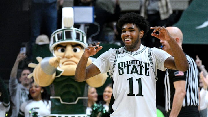 Feb 8, 2025; East Lansing, Michigan, USA;  Michigan State Spartans guard Jase Richardson (11) celebrates  against the Oregon Ducks at the end of the game at Jack Breslin Student Events Center. Mandatory Credit: Dale Young-Imagn Images