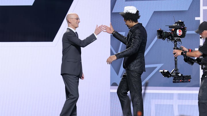 Dylan Harper walks up to Adam Silver after being drafted by the San Antonio Spurs on June 25, 2025.