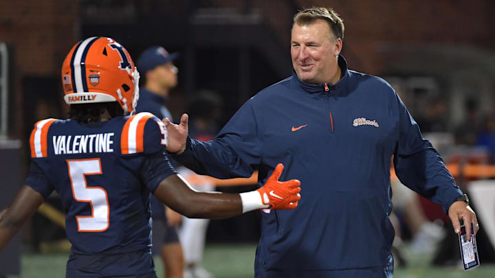 Aug 29, 2024; Champaign, Illinois, USA;  Illinois Fighting Illini head coach Bret Bielema greets running back Ca'Lil Valentine (5) before the first half at Memorial Stadium. Mandatory Credit: Ron Johnson-Imagn Images