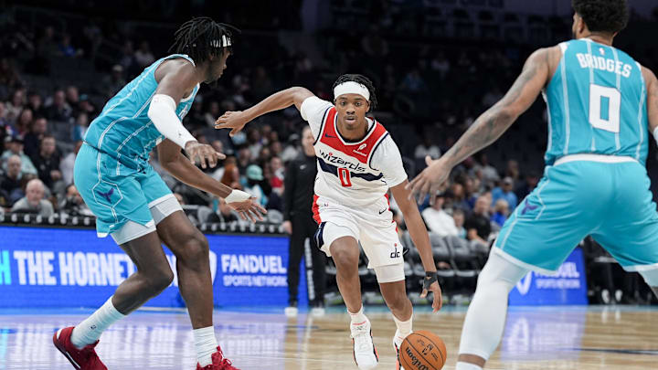 Feb 3, 2025; Charlotte, North Carolina, USA; Washington Wizards guard Bilal Coulibaly (0) drives to the basket against Charlotte Hornets center Mark Williams (5) during the second half at Spectrum Center. Mandatory Credit: Jim Dedmon-Imagn Images