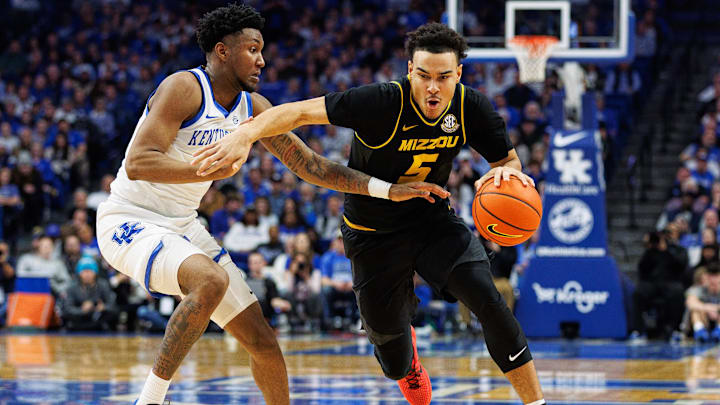 Jan 9, 2024; Lexington, Kentucky, USA; Missouri Tigers guard John Tonje (5) drives to the basket against Kentucky.